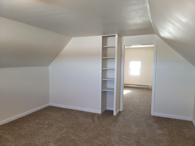 bonus room featuring baseboard heating, lofted ceiling, and dark carpet