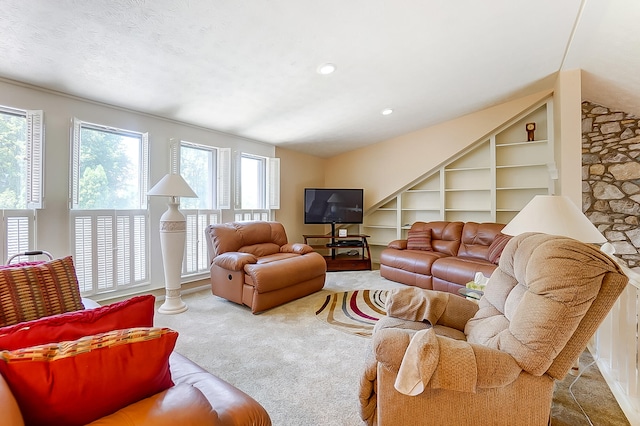living room featuring carpet flooring and built in features