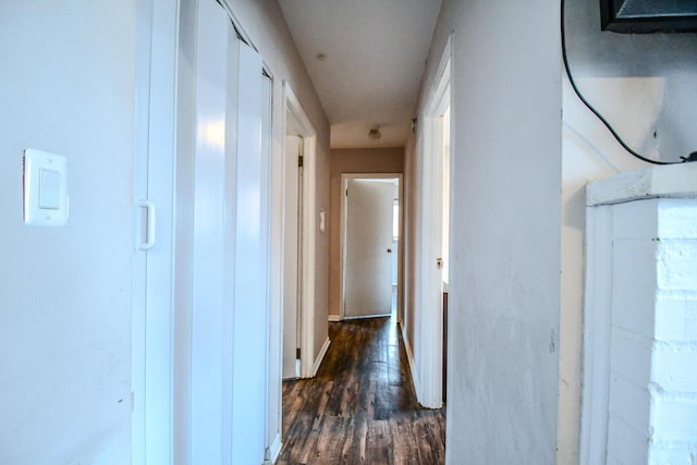 corridor featuring dark hardwood / wood-style floors