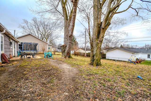 view of yard featuring a trampoline