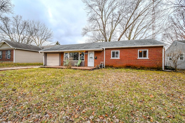 ranch-style home with a garage and a front yard