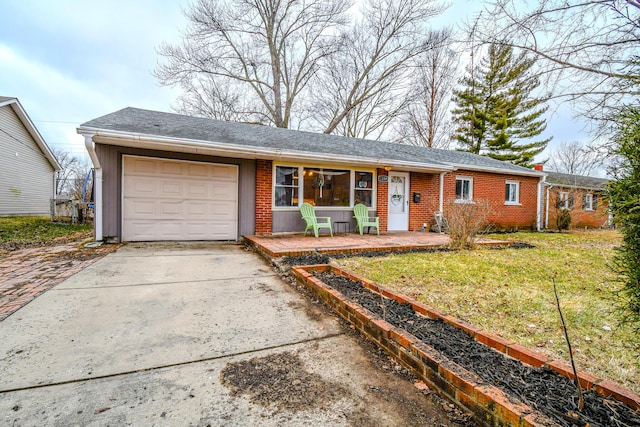 single story home featuring a garage and a front yard