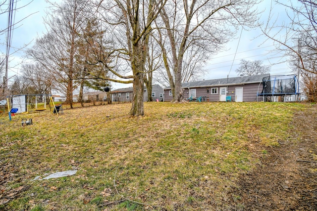 view of yard with a trampoline