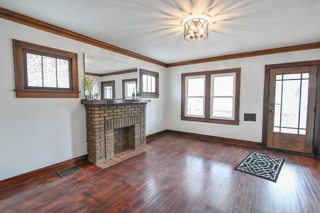 unfurnished living room featuring dark wood-style floors, plenty of natural light, visible vents, and baseboards