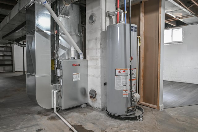 utility room featuring water heater and heating unit