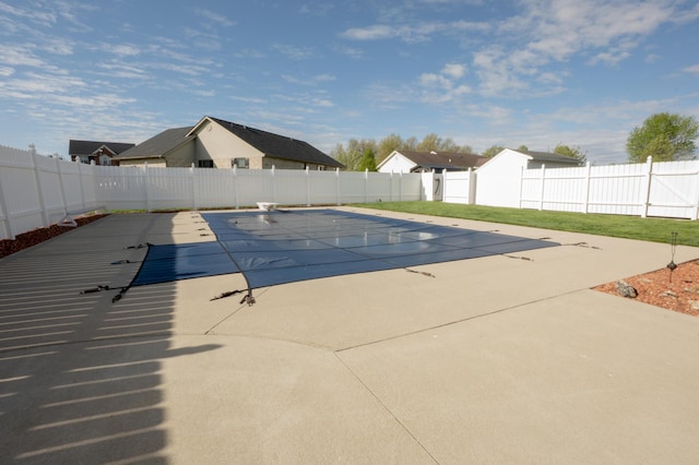 view of pool featuring a fenced in pool, a fenced backyard, and a patio area