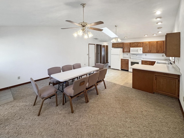 dining room with a ceiling fan, baseboards, lofted ceiling, recessed lighting, and light colored carpet