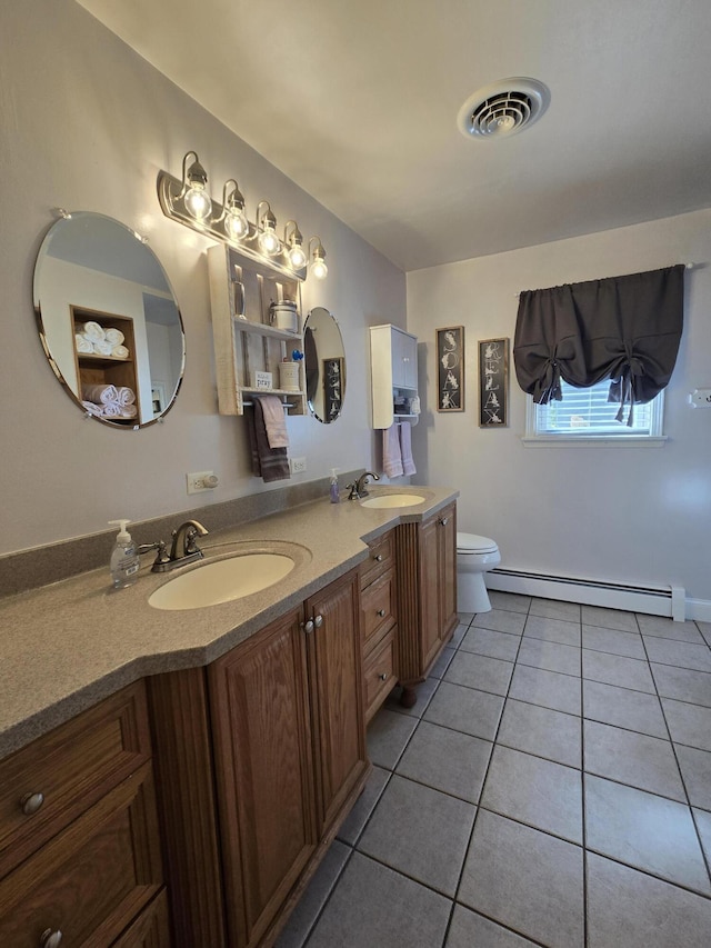 14715 County Road 66a, Saint Marys, OH 45885 - bathroom featuring visible vents, a sink, tile patterned flooring, and baseboard heating