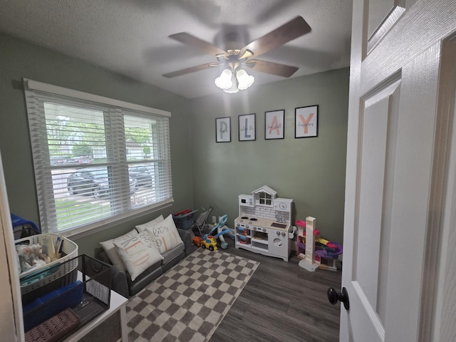 314 Concord Ave, Saint Marys, OH 45885 - recreation room featuring dark wood-type flooring, a ceiling fan, and a textured ceiling