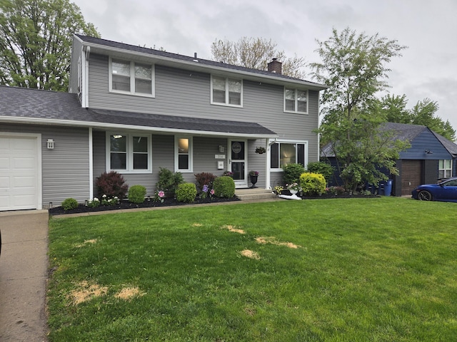 314 Concord Ave, Saint Marys, OH 45885 - view of front facade with a chimney, a front lawn, and a garage
