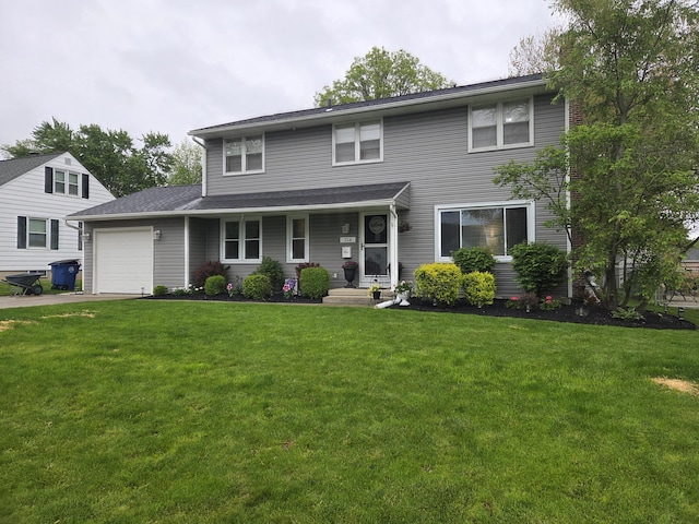 314 Concord Ave, Saint Marys, OH 45885 - view of front of house featuring a garage, a front lawn, driveway, and covered porch