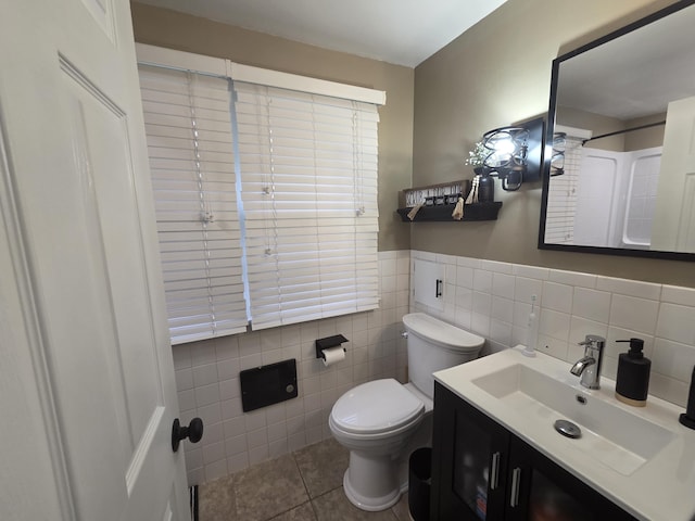 314 Concord Ave, Saint Marys, OH 45885 - full bath with toilet, tile walls, tile patterned floors, vanity, and a wainscoted wall