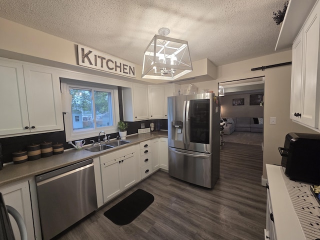 314 Concord Ave, Saint Marys, OH 45885 - kitchen with stainless steel appliances, a sink, a textured ceiling, white cabinets, and dark wood-style floors