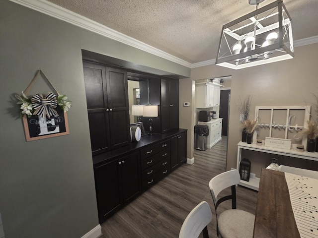 314 Concord Ave, Saint Marys, OH 45885 - dining space featuring dark wood-type flooring, crown molding, a textured ceiling, and baseboards