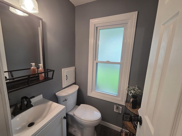 314 Concord Ave, Saint Marys, OH 45885 - bathroom featuring toilet, baseboards, and vanity