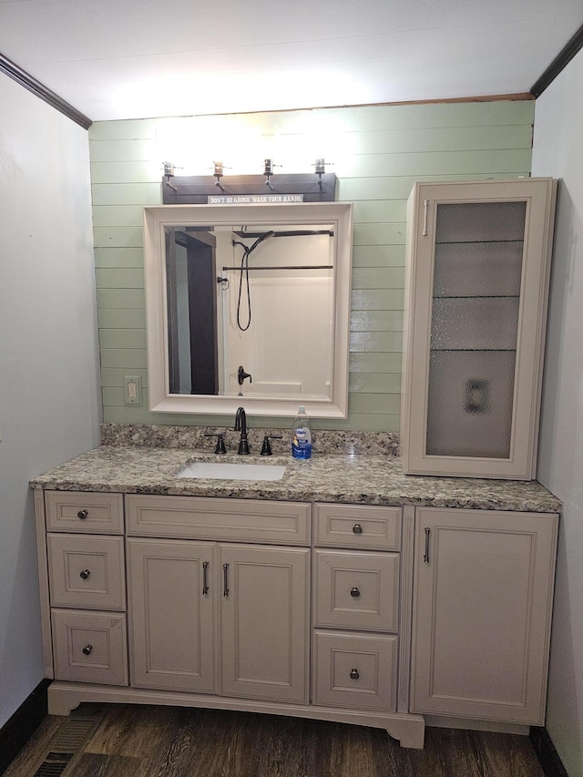 2 E Main St, Fletcher, OH 45326 - bathroom with double vanity, wood finished floors, and ornamental molding