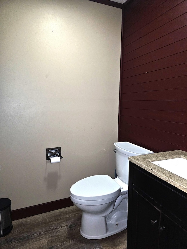2 E Main St, Fletcher, OH 45326 - half bath with vanity, wood finished floors, and wood walls
