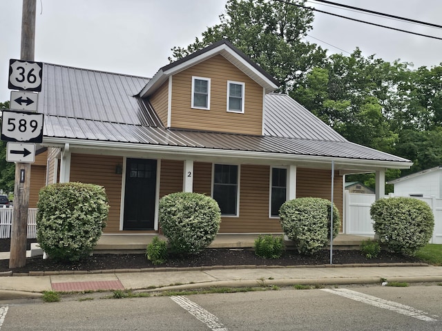 2 E Main St, Fletcher, OH 45326 - view of front facade with a porch and a metal roof