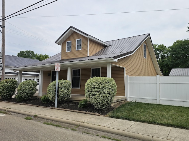 2 E Main St, Fletcher, OH 45326 - view of front of property featuring covered porch and a metal roof