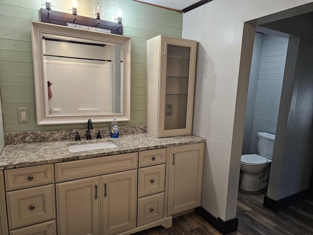 2 E Main St, Fletcher, OH 45326 - bathroom with wood finished floors, vanity, and wooden walls