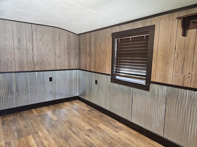 2 E Main St, Fletcher, OH 45326 - spare room featuring wood finished floors and wooden walls