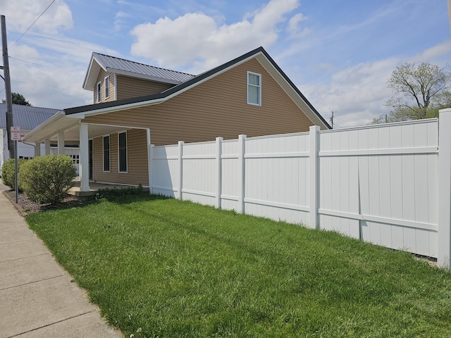 2 E Main St, Fletcher, OH 45326 - view of side of property featuring a porch and a metal roof