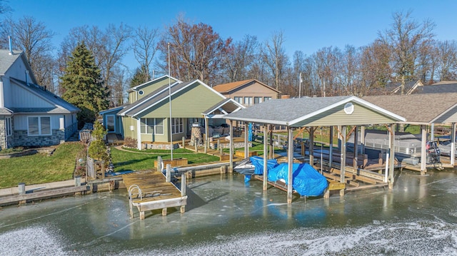 view of dock featuring a water view and a yard