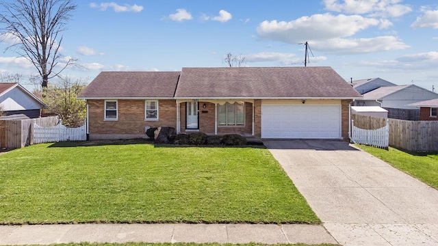 1405 Providence Ave, Springfield, OH 45503 - view of front of property featuring a garage, brick siding, driveway, and roof with shingles