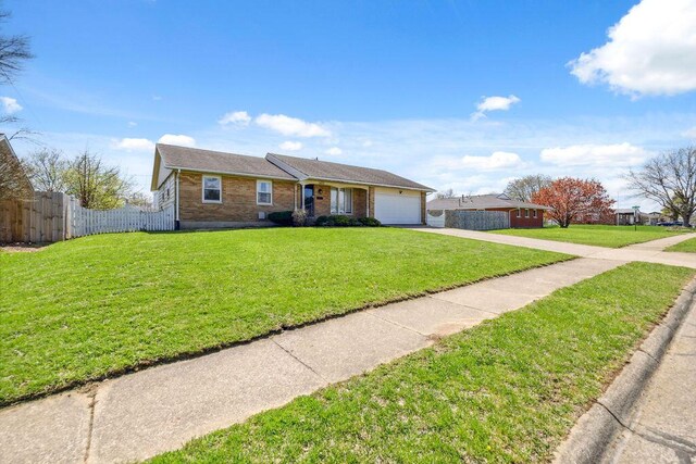 1405 Providence Ave, Springfield, OH 45503 - single story home featuring concrete driveway, an attached garage, and brick siding