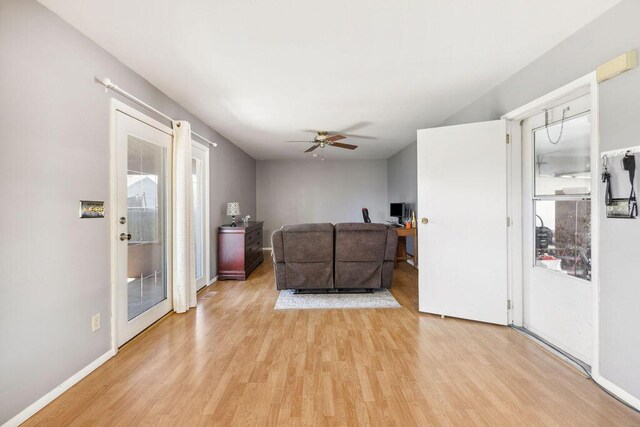 1405 Providence Ave, Springfield, OH 45503 - living room with light wood-type flooring, a ceiling fan, healthy amount of natural light, and a desk