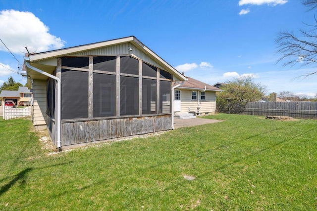 1405 Providence Ave, Springfield, OH 45503 - rear view of property with a sunroom and a fenced backyard