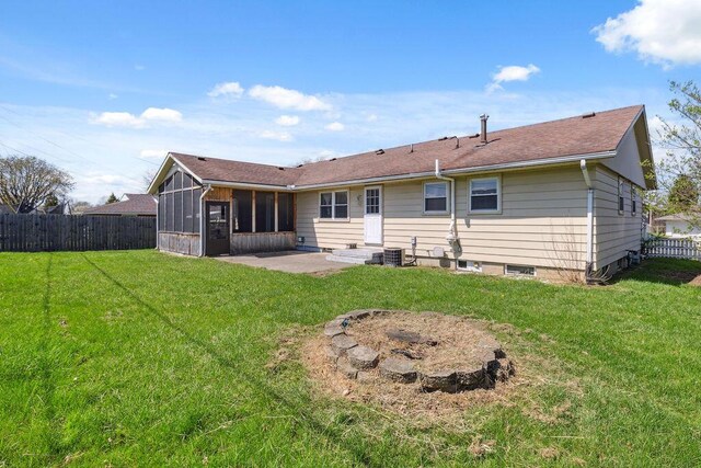 1405 Providence Ave, Springfield, OH 45503 - back of property featuring a sunroom, a fenced backyard, and a patio