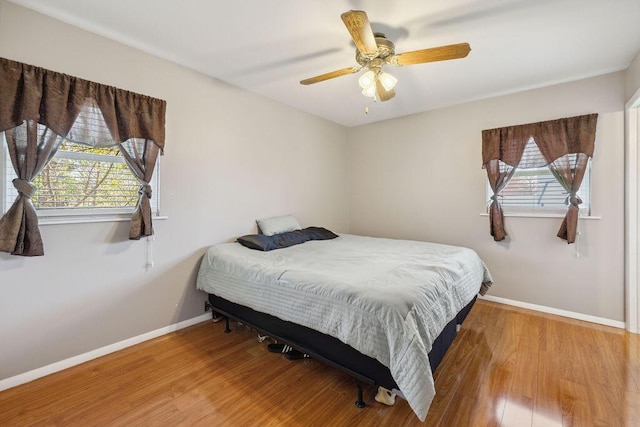 1405 Providence Ave, Springfield, OH 45503 - bedroom with multiple windows, wood finished floors, and a ceiling fan