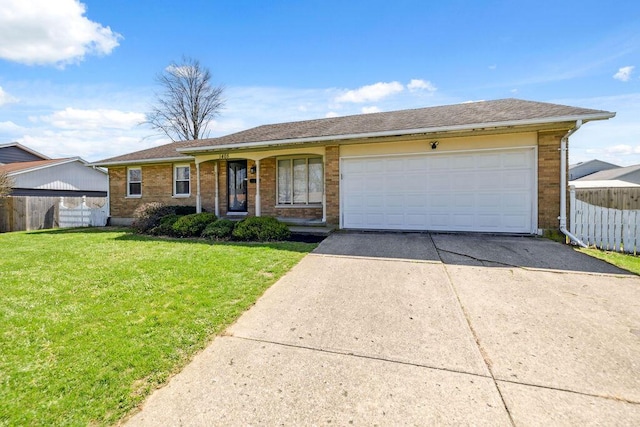 1405 Providence Ave, Springfield, OH 45503 - ranch-style house with driveway, brick siding, and an attached garage