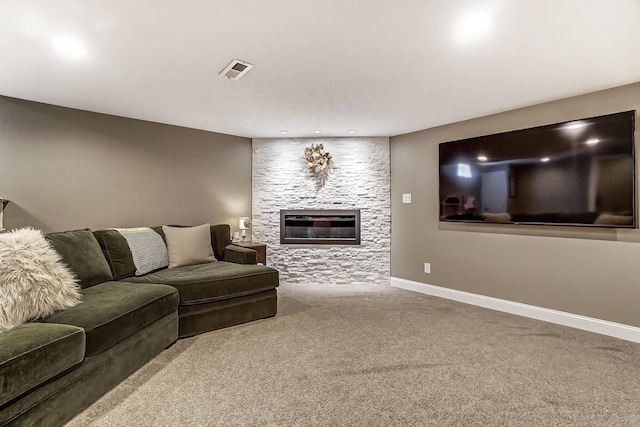 living area featuring visible vents, baseboards, recessed lighting, a fireplace, and carpet flooring