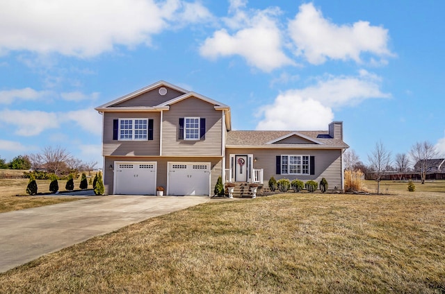 split level home with a chimney, driveway, an attached garage, and a front lawn