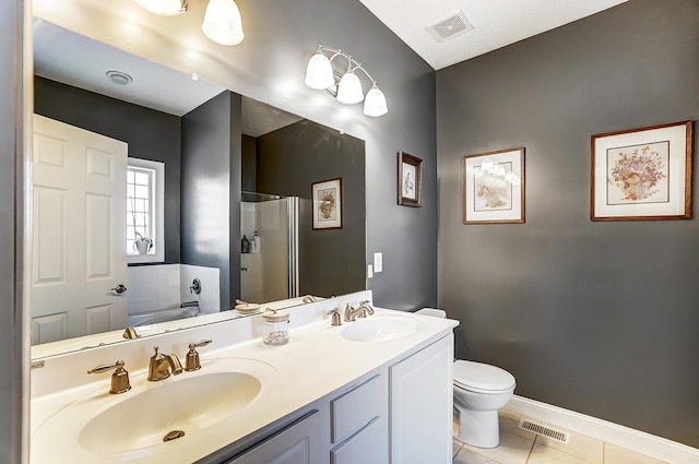 bathroom with tile patterned flooring, visible vents, and a sink