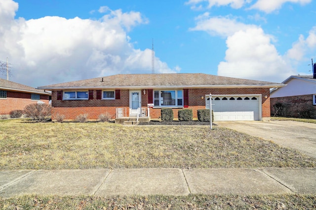 ranch-style home with brick siding, driveway, and a garage