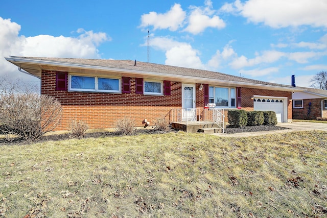 ranch-style home with an attached garage, brick siding, and driveway