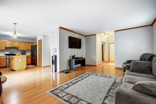 living room with ornamental molding and light wood-type flooring