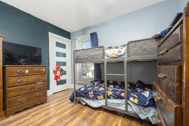 bedroom featuring light wood finished floors