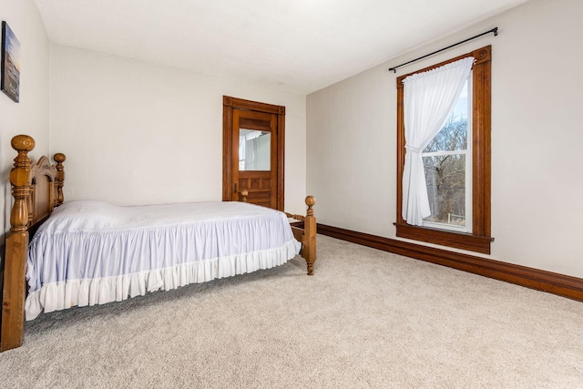 carpeted bedroom with baseboards