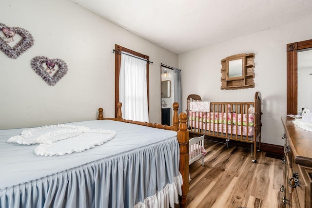 bedroom with wood-type flooring