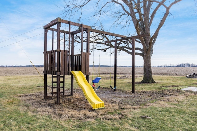 view of jungle gym featuring a rural view