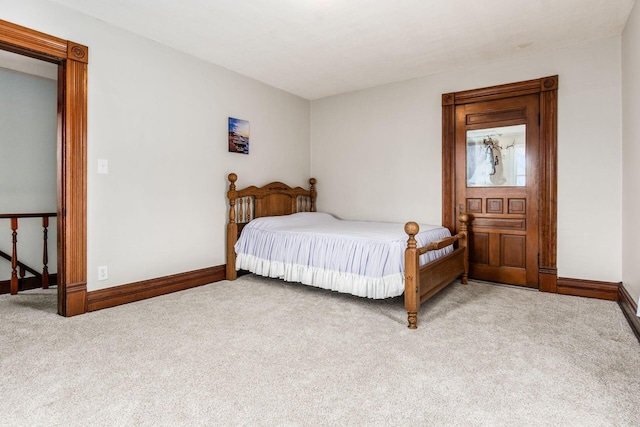 bedroom featuring light carpet