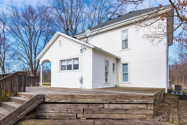 rear view of house with a wooden deck and central AC unit