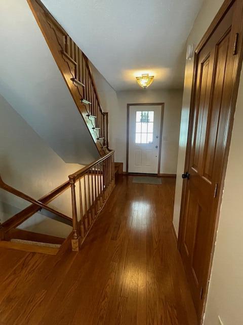 450 Yale Ave, Lima, OH 45804 - entryway featuring stairway, baseboards, and wood finished floors