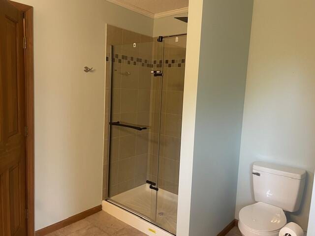 450 Yale Ave, Lima, OH 45804 - bathroom featuring toilet, ornamental molding, baseboards, and a shower stall