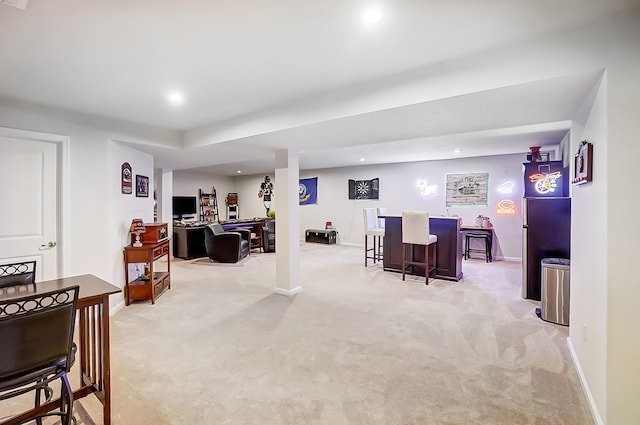 interior space with light colored carpet and bar area