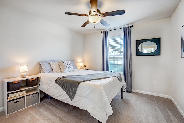 bedroom featuring ceiling fan and carpet